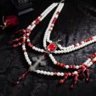 White cross red drops and layered bead clothing swag
