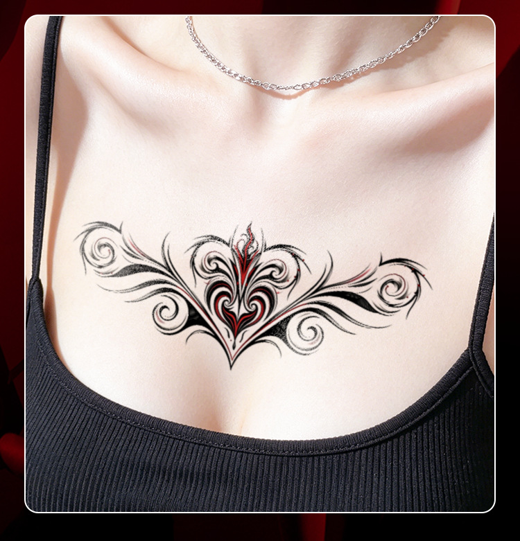 Black and red ornamental scroll temporary tattoo on chest