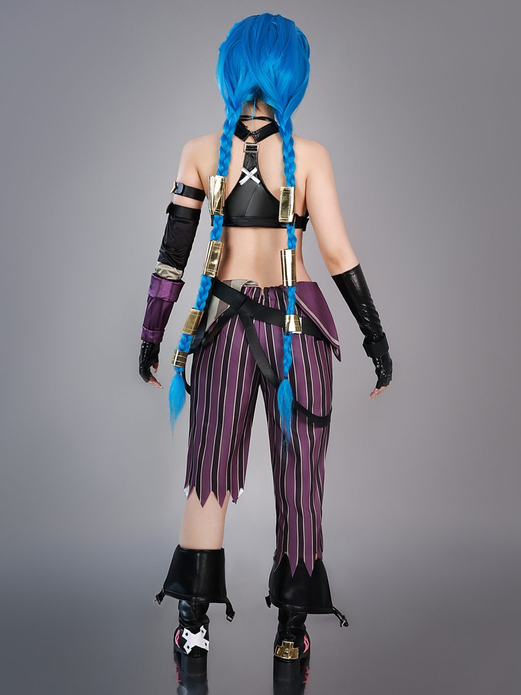 Back of Jinx costume with belt and striped pants; hair styled with a separate wig