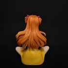 Rear of seated Asuka figure showing long sculpted orange hair