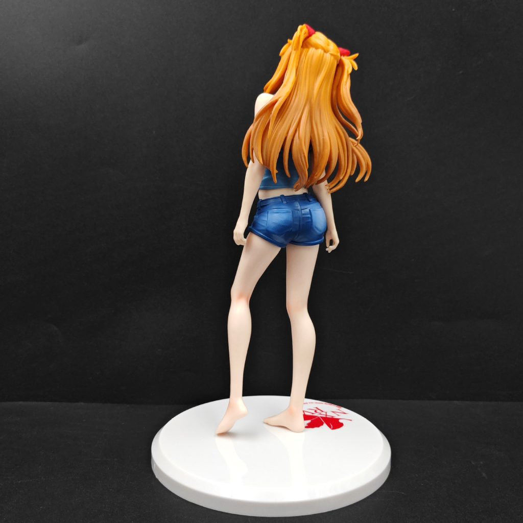 Rear view of Asuka figure with long twin-tail hair and dark blue shorts
