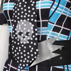 Close view of polka-dot skull tie and silver lightning detail on black waist belt