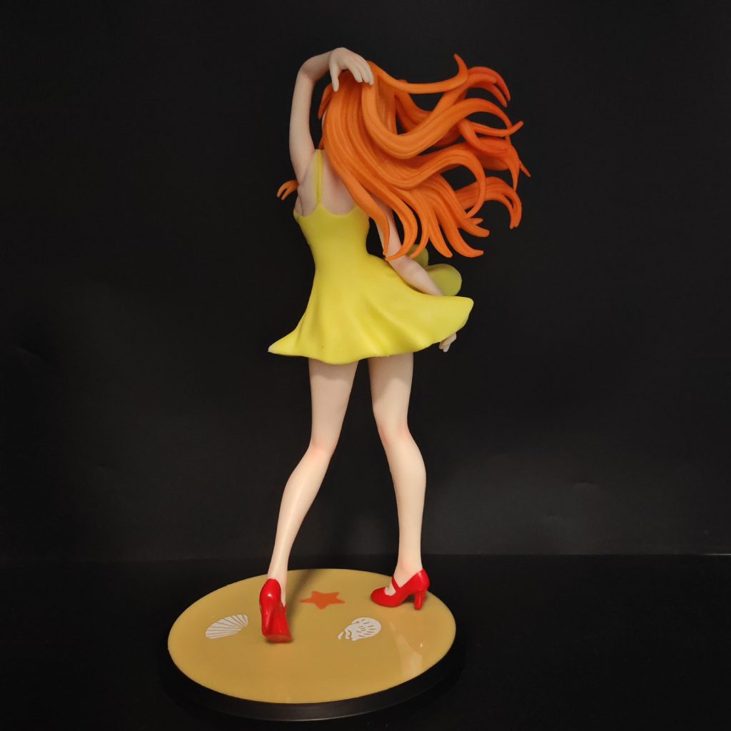 Rear view of Asuka's flowing hair and yellow dress