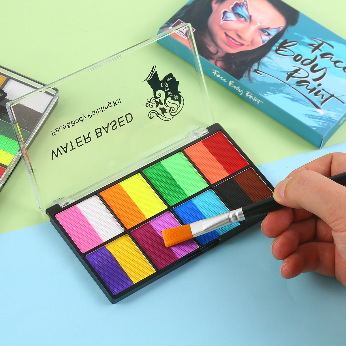 Flat brush loading color from the two-color A eight-pan face paint palette