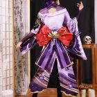 Rear costume view with red bow and purple trailing panels
