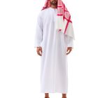 Front view of a model wearing a white long-sleeved robe with a red-and-white patterned headscarf and black head cord