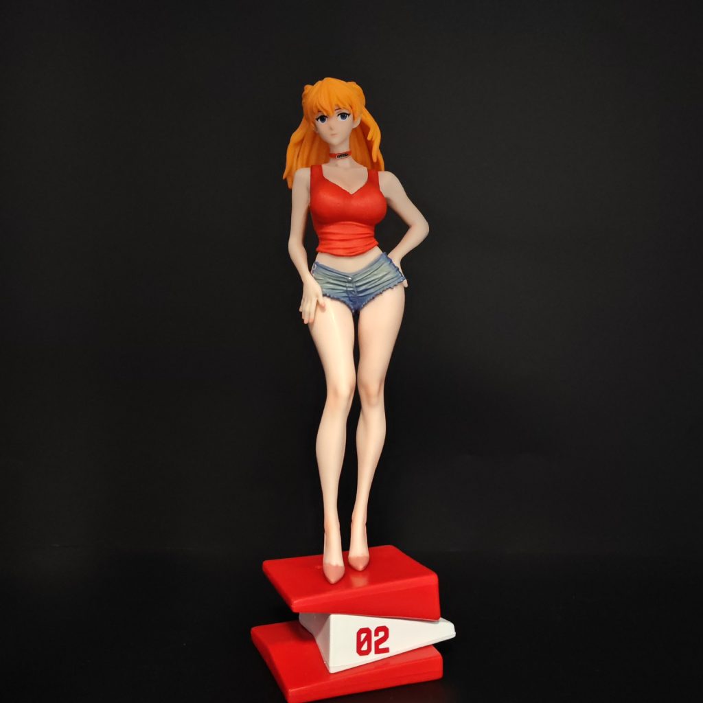 Straight-on view of Asuka figurine on the red-and-white 02 display base