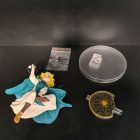 Coco figure with separate round base, patterned circular backdrop and connectors