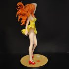 Angled side view of Asuka's sculpted orange hair and yellow dress