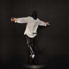 Rear of singing pose figure and display base
