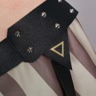 Black studded hip strap and gold triangular detail on Jinx costume