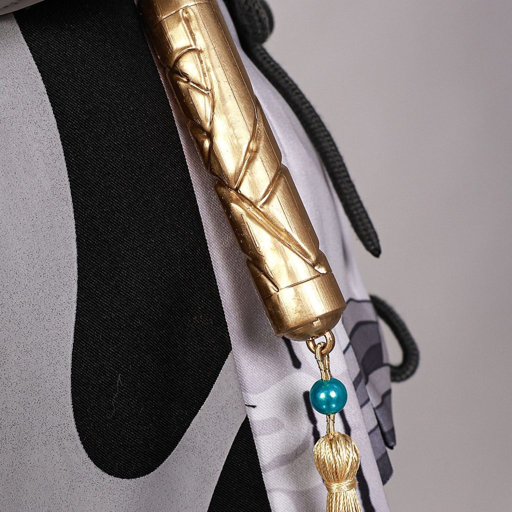 Gold tassel with blue bead on the female Rover costume