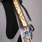Gold tassel with blue bead on the female Rover costume
