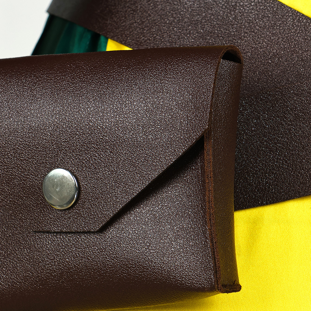 Brown waist pouch with snap closure on crossed belt