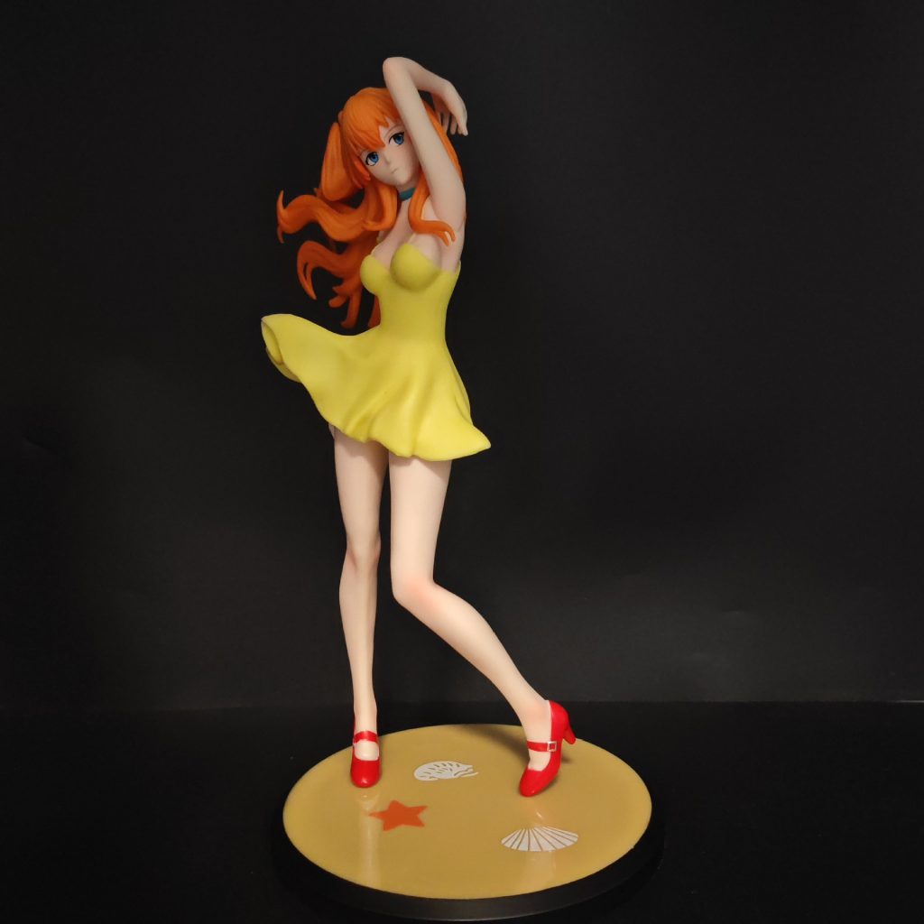 Asuka display figurine in profile on round yellow base