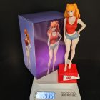 Asuka display figurine beside its illustrated purple box
