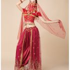 Burgundy costume side view showing wide pants and sheer embroidered panels