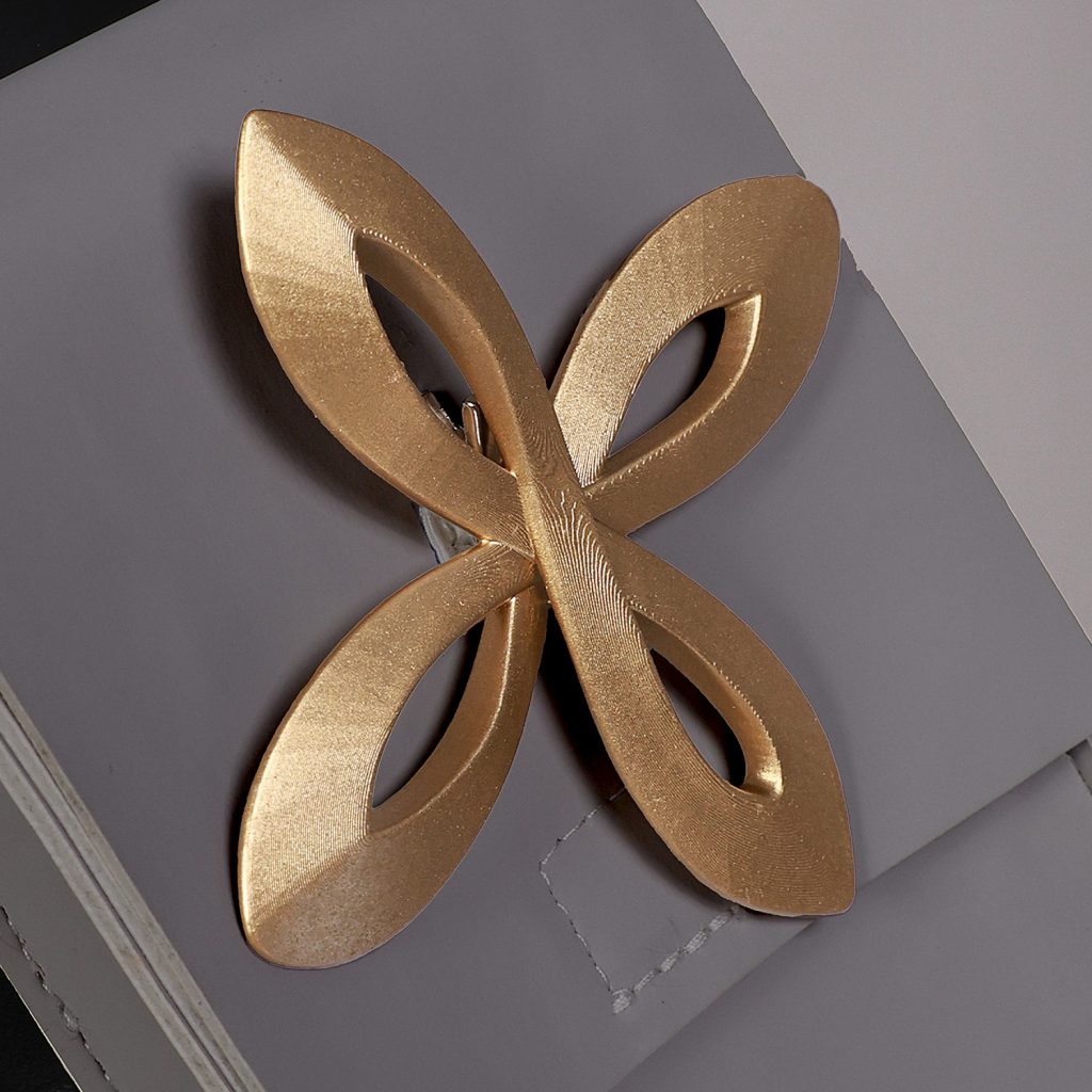 Gold four-petal ornament on female Rover waist accessory