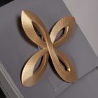 Gold four-petal ornament on female Rover waist accessory