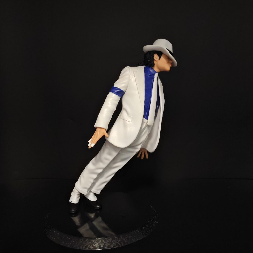 White suit leaning pose figure with white fedora and blue shirt