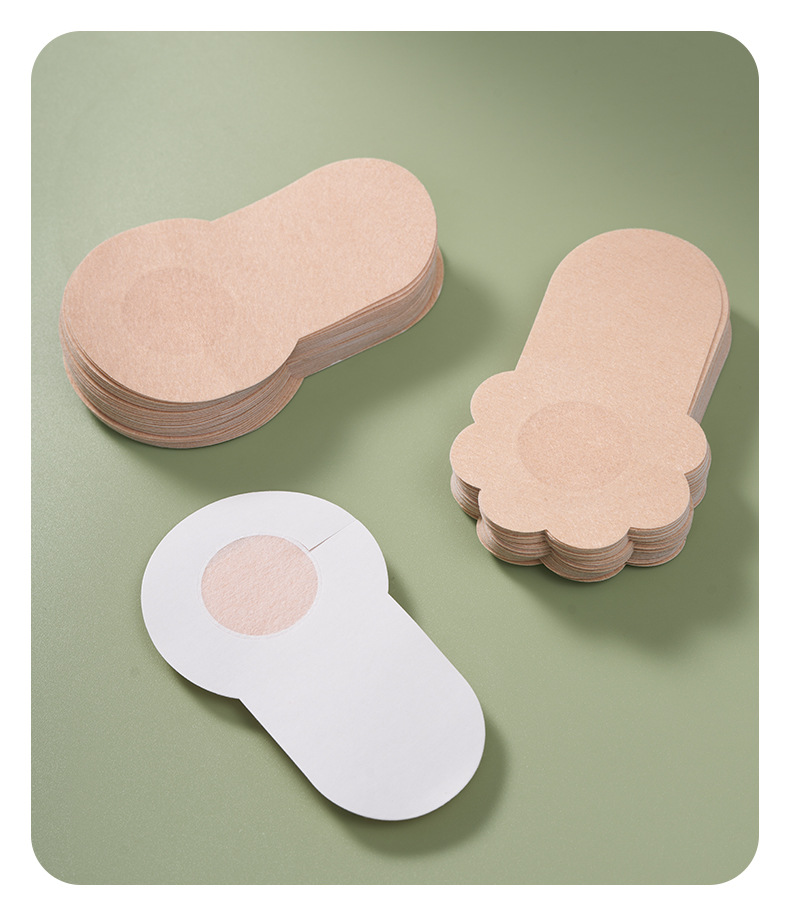Light beige flower-shaped adhesive patch alongside circular example and protective backing