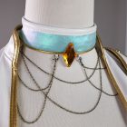 Child Mira blue choker detail with amber-colored diamond ornament and draped chains