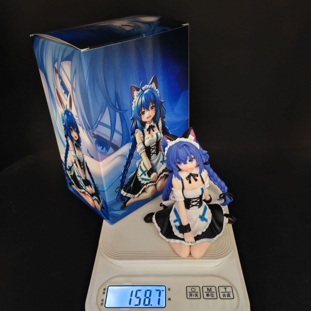 Seated cat-maid figurine next to illustrated box packaging