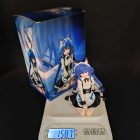 Seated cat-maid figurine next to illustrated box packaging