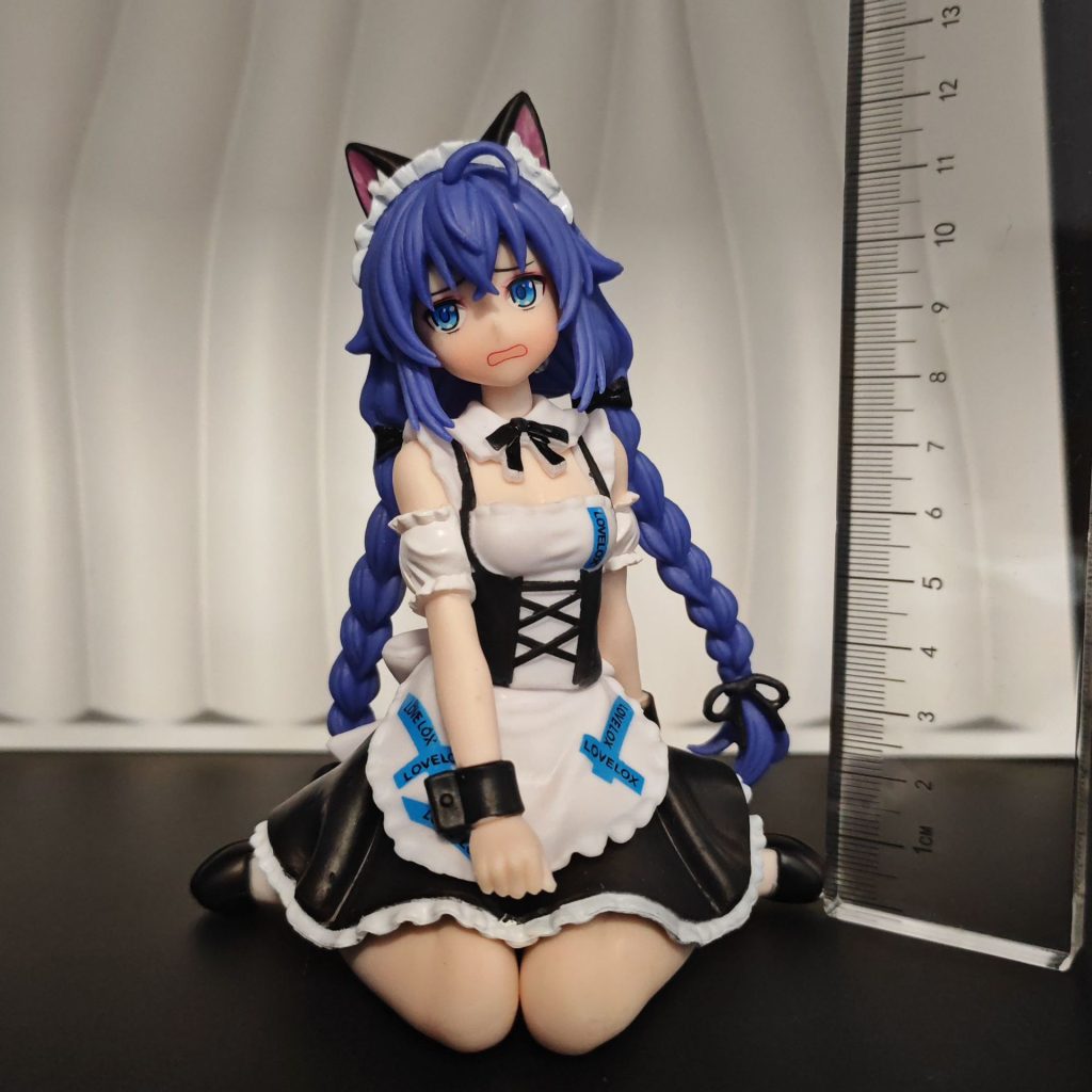 Standing and sitting cat-maid figurines shown together beside ruler for scale