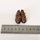 Actual brown 1:6 figure bow-strap miniature shoe pair with black trim next to metric ruler