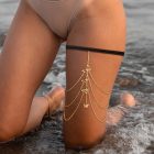 Gold-colored butterfly leg chain worn placement