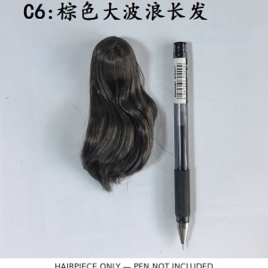 Brown long-wavy miniature figure hairpiece photographed beside a pen for visual scale; pen not included