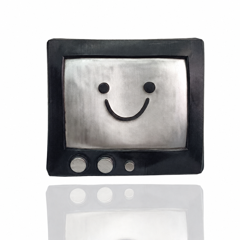 Smiling TV costume mask with black frame, silver-tone smile panel and three decorative knobs