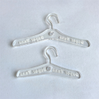 Two clear miniature clothes hangers, 7 cm and 9 cm, compared side by side
