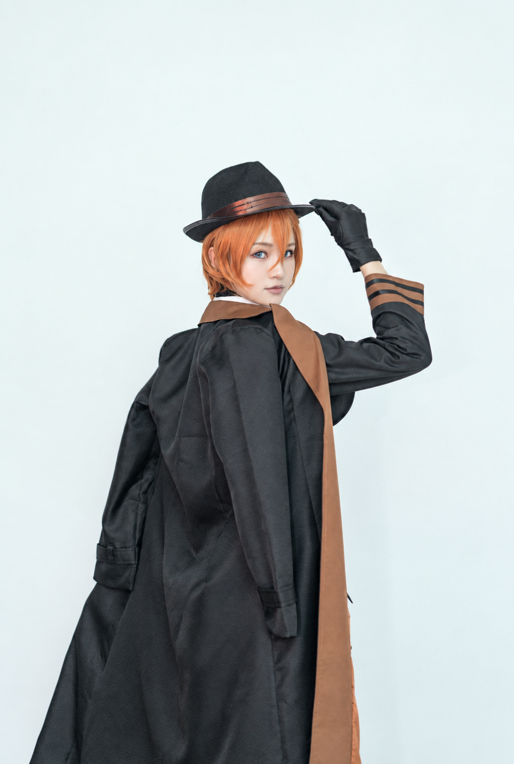 Chuuya costume long black coat seen from behind, with brown lapel and striped cuff