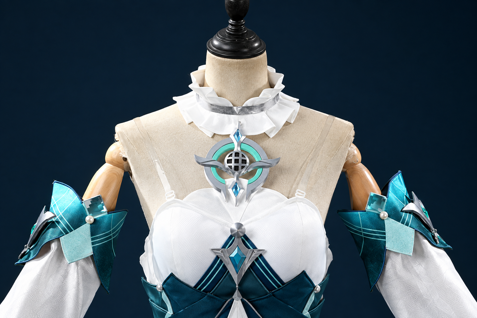Ruffled collar and teal-and-silver bodice details