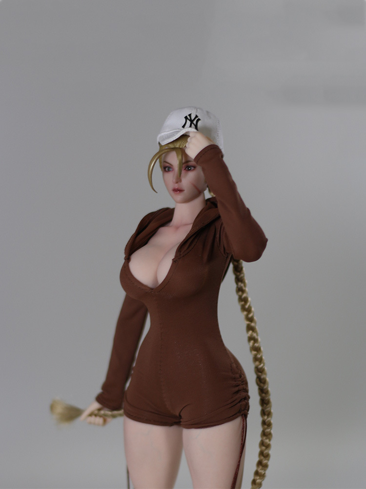 Brown DF099 miniature hooded romper modeled on styled figure, figure cap wig and accessories excluded