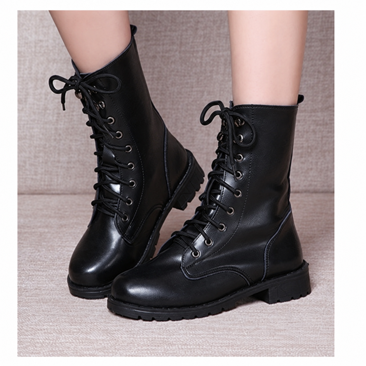 Black lace-up flat ankle boots with rounded toe and low heel