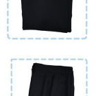Folded black uniform jacket and matching straight-leg trousers
