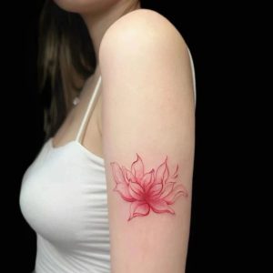 Open pink linework lotus temporary tattoo on upper arm