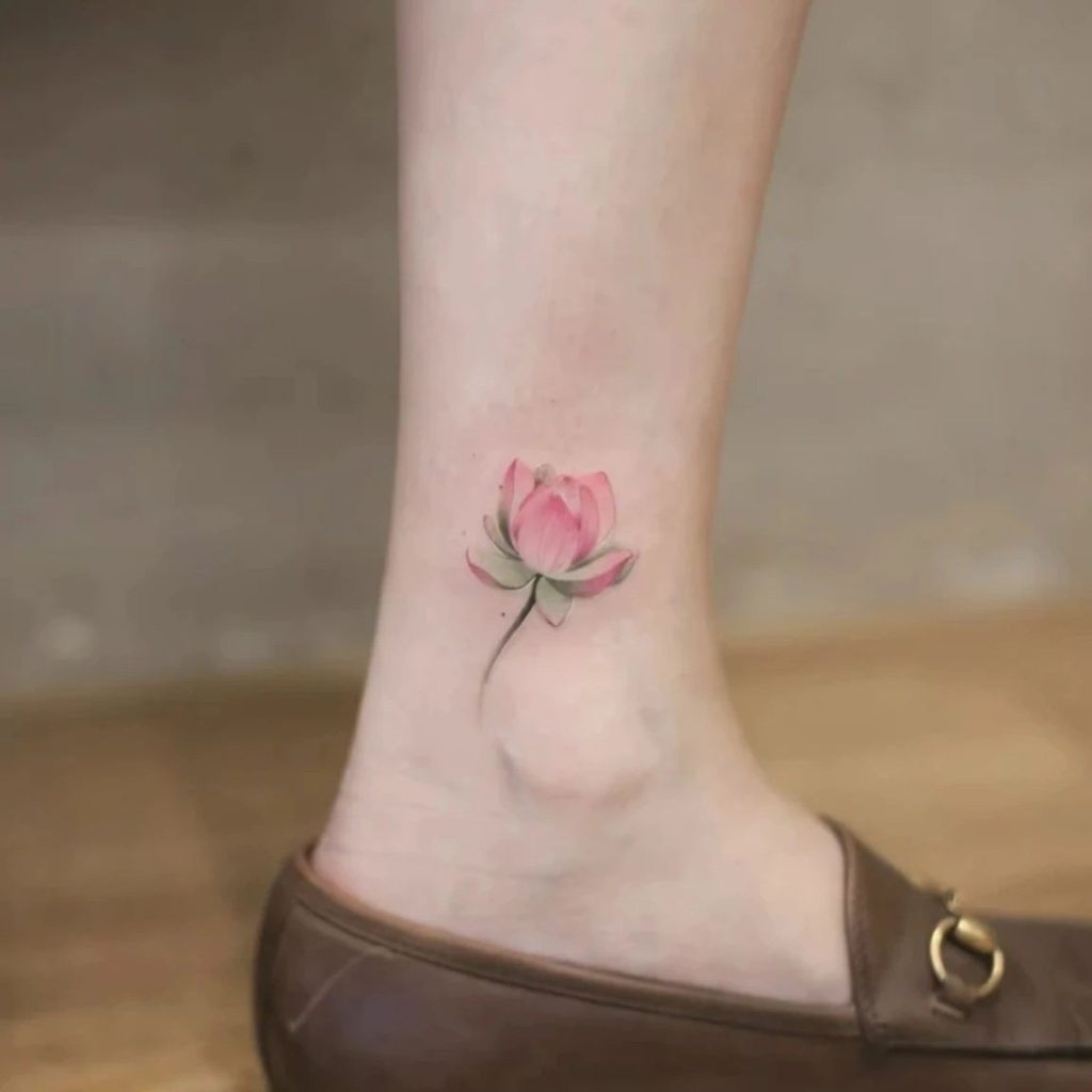 Small pink lotus bud temporary tattoo on ankle