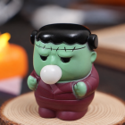 Green stitched monster Halloween squeeze toy with dark hair