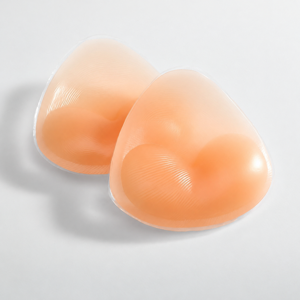 Pair of nude triangular silicone bra inserts