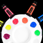 Six paint colors on a demonstration palette with matching tubes; palette and all six tubes are not an included set