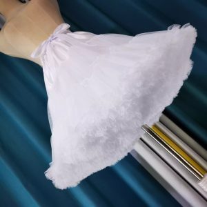 White layered petticoat worn beneath a skirt