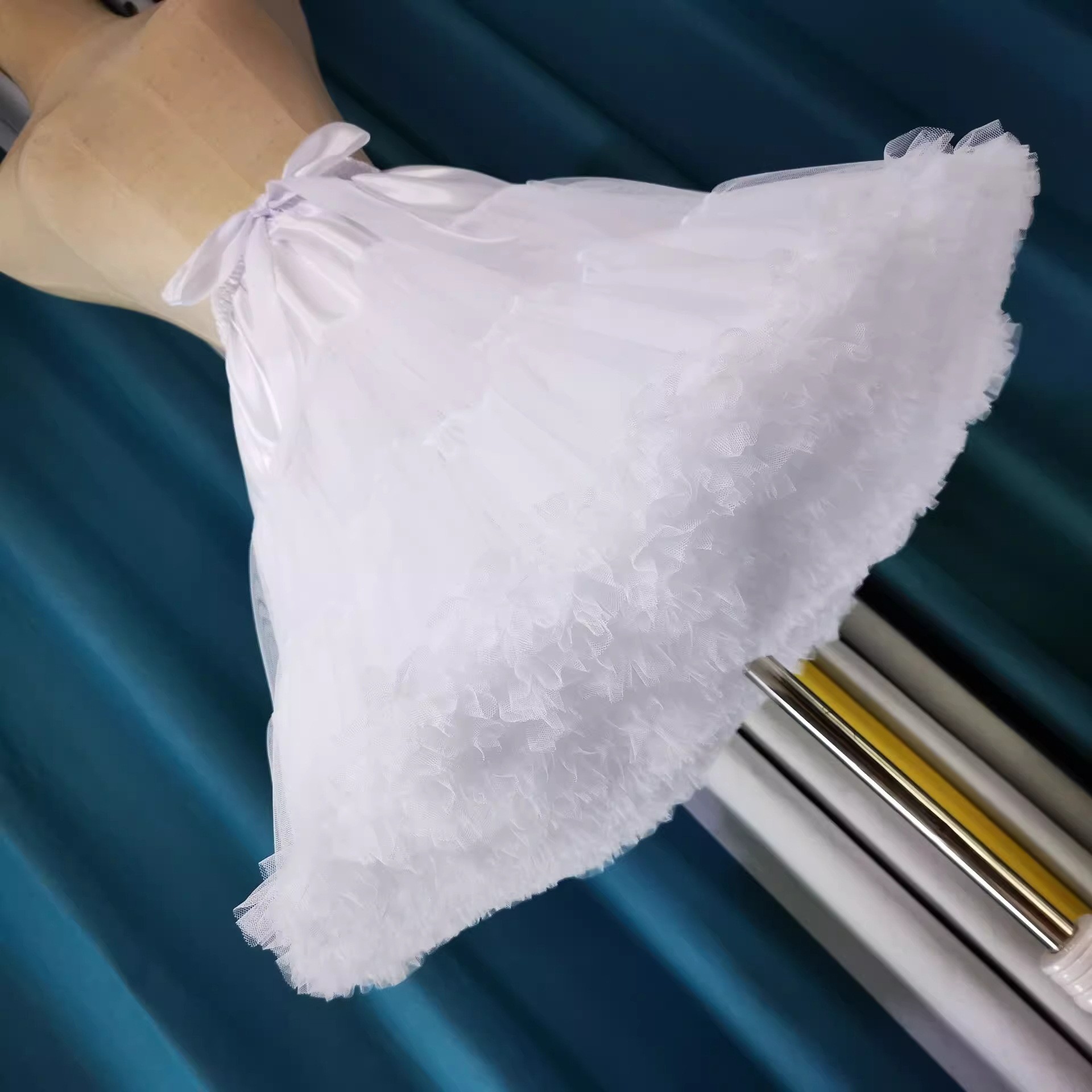 White layered petticoat worn beneath a skirt