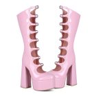 Pink buckle-front platform boots — pair, front three-quarter view