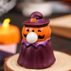 Pumpkin witch Halloween squeeze toy with orange face and purple robe