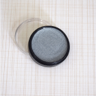 Silver metallic cosmetic paint in a round pot with clear lid