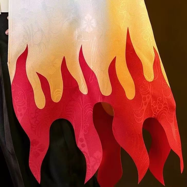 Close-up of cream, yellow and red flame haori hem and tonal pattern